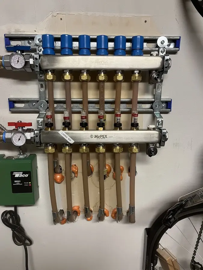 Plumber performing Water Heater Repair at a residential property in Durand